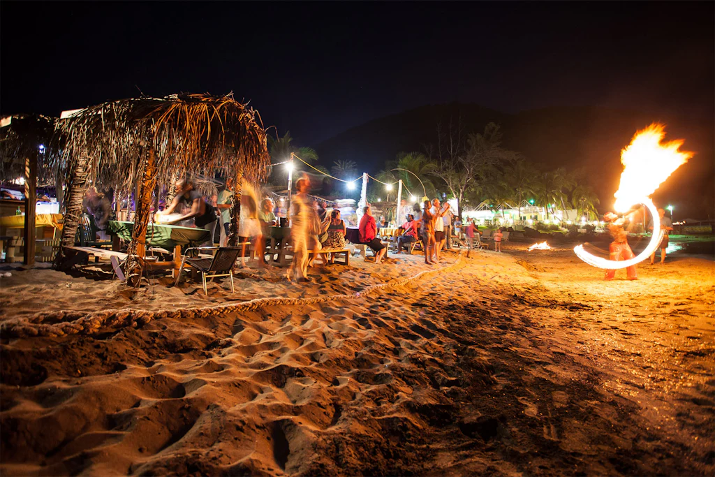Dance the night away at a beach bar along The Strip in Frigate Bay