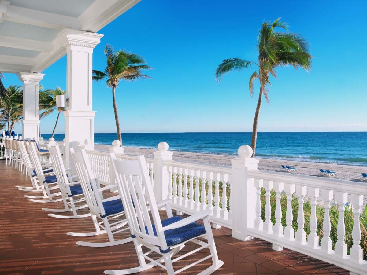 Veranda chairs on deck of Grand Pelican Beach Resort