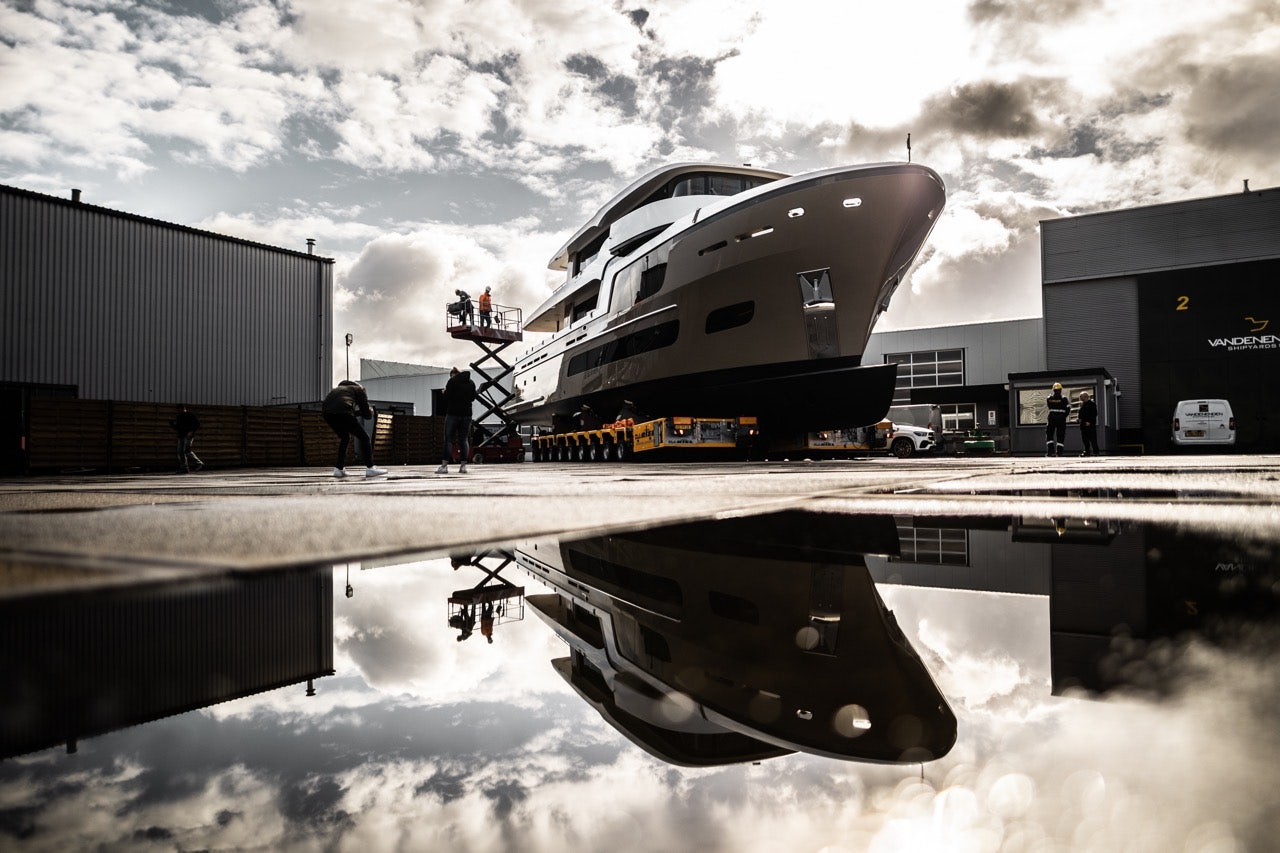 photo of a superyacht under construction at the van der valk shipyard in the netherlands, huge superyacht dry docked, high quality editorial style image